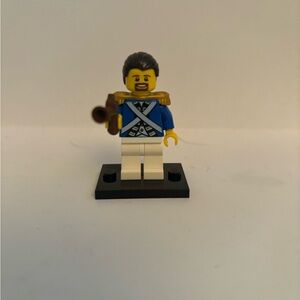 Lego Minifigure is from the Pirate themed sets (pi150)